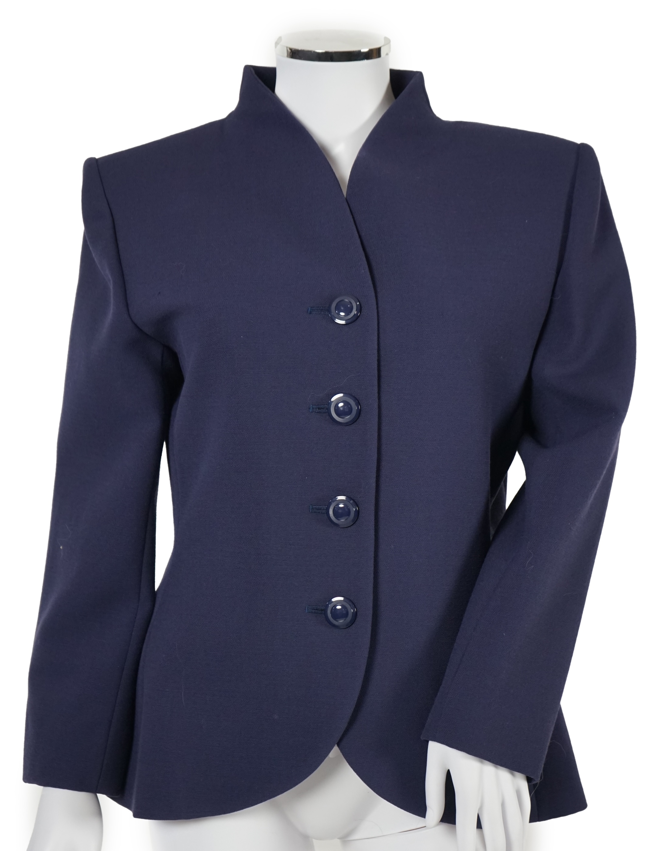 A vintage Yves Saint Laurent variation lady's navy wool skirt suit, F 42 (UK 14).Please note alterations to make the waist smaller may have been carried out on some of the skirts. Proceeds to Happy Paws Puppy Rescue.